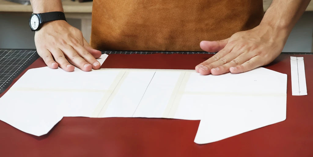 Tape the pattern onto leather