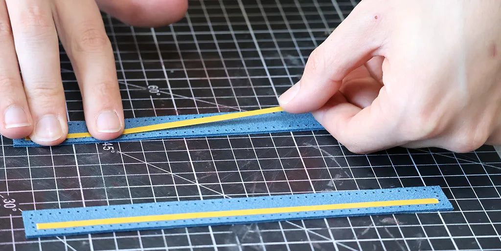 Apply double-sided tape to the leather