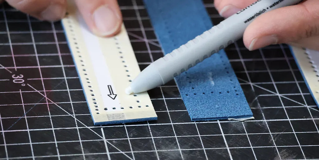 Trace the direction of the leather