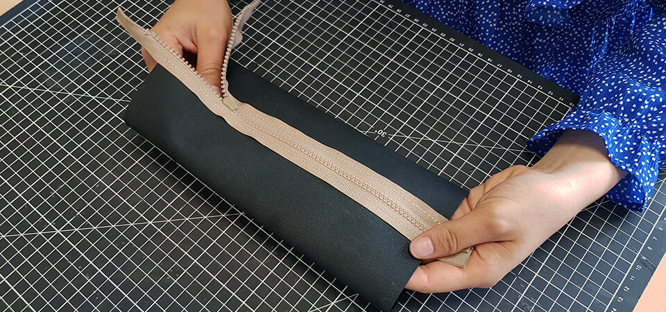 Coudre la largeur de la trousse