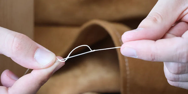 Nouer le fil à l'aiguille