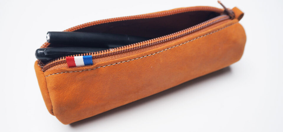 trousse ronde en cuir